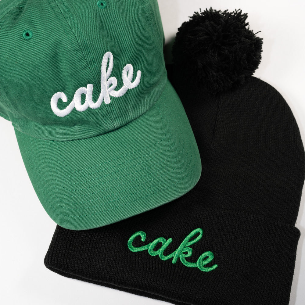 
                  
                    Cake Script Knit Winter Hat | Edina Pom Hat - Northmade Co
                  
                